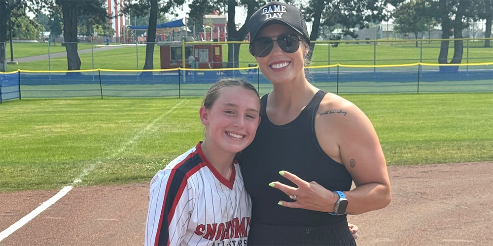 Danielle Lawrie with daughter on softball field
