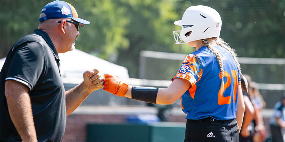 LLSWS Coach Fist Bumping with Player